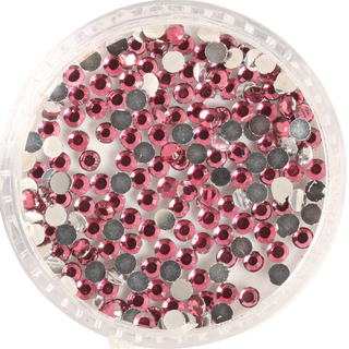 Round container filled with pink rhinestones on a white background