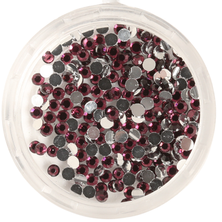 Round container filled with small purple rhinestones on a white background