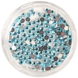 Round container filled with small blue rhinestones on a white background
