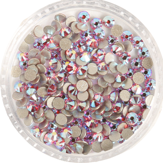 Clear container filled with multicolored rhinestones on a white background
