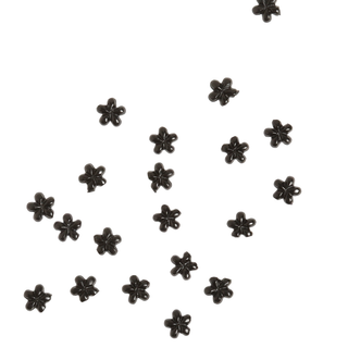 Black flower-shaped rhinestones scattered on a white background